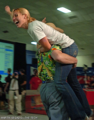 Stephanie A. Sidelko '07 is carried around the stage by Professor Alexander H. Slocum PhD '85 after winning this year's 2.007 competition. At the beginning of the semester Sidelko "just wanted a robot that would move", but she ended up placing first out of more than one hundred students.
