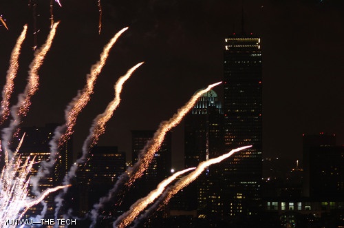 Fireworks produced by Pyro Spectaculars glimmer over the Boston Skyline during Independence Day 2007 celebrations.