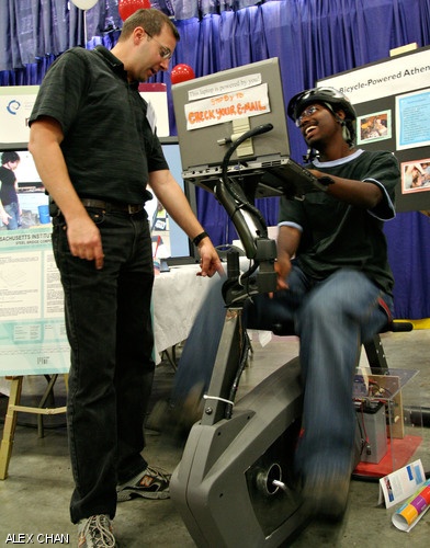 Civil and Environmental Engineering Instructor Stephen W. Rudolph shows Robert K. Brown ’11 a laptop computer powered by an exercise bike at yesterday’s Academic Expo in Johnson Ice Rink. The Expo gave freshmen a chance to meet faculty members from all of MIT’s Departments and academic programs.