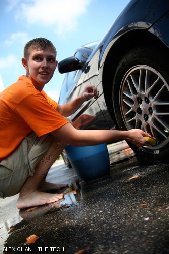 Kyle L. Fink ’11 washes cars at Ruah House during MIT’s CityDays on Friday, Aug. 31. Their car washing benefitted the local non-profit agency Cambridge Cares About AIDS.