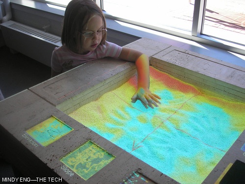 A young girl experiments with a new elevation mapping display at the MIT Museum. The museum had a grand re-opening on Saturday and Sunday after an extensive renovation added the Mark Epstein Innovation Gallery on the first floor.
