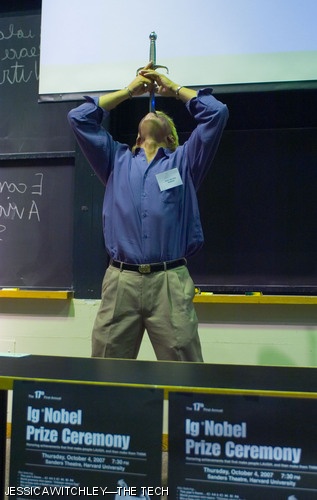 Ig Nobel Prize recipient Dan Meyer of Antioch, Tenn. swallows a sword in front of hundreds at the Ig Informal Lectures in 10-250 on Saturday, Oct. 6. Meyer is a professional sword swallower who co-authored a paper, “Sword swallowing and its side effects,” which won this year’s Ig Nobel in Medicine. See page 12 for more photos.