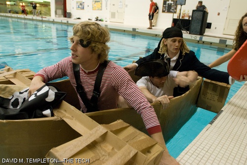Gavin M. Cotter ’09, Stephen P. Fournier ’09, and Alan D. Foreman ’09 (left to right) enter their boat, The Black Pearl, at the start of the final race at the Head of the Zesiger Cardboard Boat Regatta on Friday, Oct. 19. Shortly after entering the Pearl, as the race was starting, the boat started taking on water and sunk.