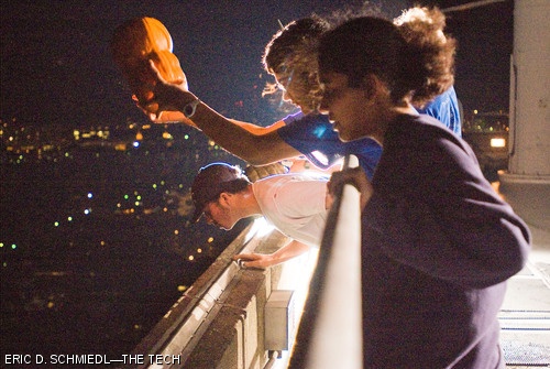 (Front to back) Asilata A. Bapat ’10, Sarang N. Kulkarni ’10, Isaac M. Asher ’10, and Eric P. Brown ’08 lob pumpkins off the roof of the Green Building last Saturday night.