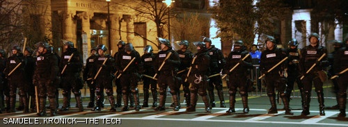 A line of police officers in riot gear blocks off Boylston Street one block west of Massachusetts Avenue in an attempt to contain the jubilant crowd that took to the streets following the Boston Red Sox victory. The Sox defeated the Colorado Rockies 4-3 on Sunday night, claiming their second World Series win in the past four seasons.