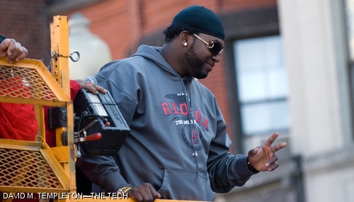 Sox Designated Hitter David Ortiz waves to fans during Wednesday’s Rolling Rally. The rally began at Fenway Park and made its way to City Hall Plaza in Duck Boats, stopping occasionally to let star closer Jonathan Papelbon perform his now famous Irish dance.