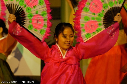 Janina Kim of Wellesley College performs during the Buchaechum fan dance at the Korean Student Association’s Culture Show held Sunday in Walker Memorial.