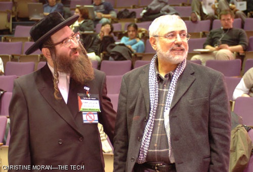 Controversial figures Yisroel Dovid Weiss (left) and Mohammad al-Asi (right) greet each other before each giving an address to the crowd.