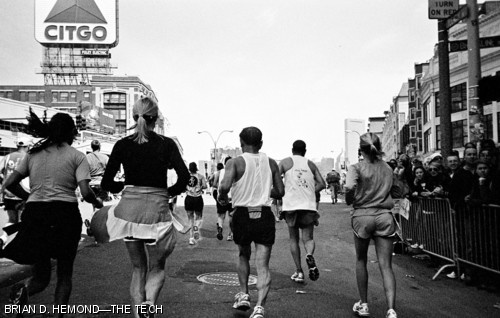 Marathoners round the corner into Kenmore Square beneath the landmark Citgo sign, less than one mile from the finish line of the 2008 Boston Marathon.
