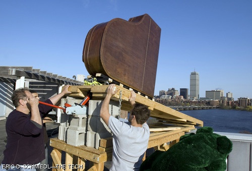Baker residents prepare to send a grand piano to a smashing demise six stories below in the annual Baker House Piano Drop on Drop Date yesterday.