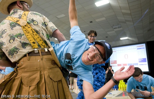 Gregory D. Tao ’10, winner of the 2.007 robotics competition “Da(yes)MIT,” is carried on a victory lap by Utilikilt-wearing Professor Alexander H. Slocum, last night in the Johnson Athletic Center.