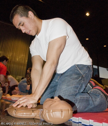 Daniel D. Jimenez ’10 learns how to perform CPR on a dummy in La Sala de Puerto Rico on April 3, 2008 in an event sponsored by MIT-EMS.