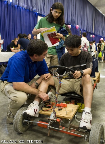 Professor Steven B. Leeb ’87 instructs freshman Rui Hu how to ride the Go-Kart with Tucker Chan ’12 looking behind them. The Go-Kart is a product of Power Electronics Laboratory (6.131).
