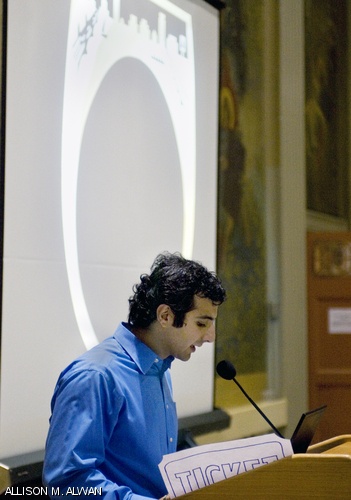 Grad Ring Committee chair Shahriar R. Khushrushahi G describes elements of the new Grad Rat to an audience of graduate students. The design was unveiled Wednesday evening in Walker Memorial.