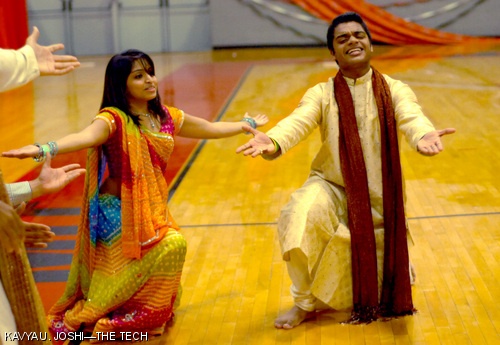 Komal Patel (left, a junior at Simmons College) and Sanjay Divakaran ’08 dance during the Bhangra portion of MIT South Asian Student’s Annual Milan Garba-Raas Dance Festival on Saturday, Oct. 11.