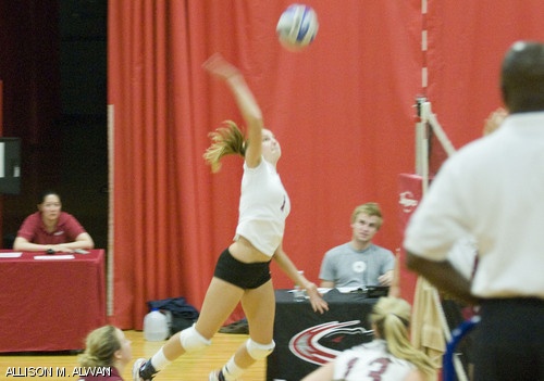Kelly E. Schulte ’12 spikes the ball during the women’s volleyball team’s 3-0 win over Worcester Polytechnic Institute on Tuesday evening in Rockwell Cage.