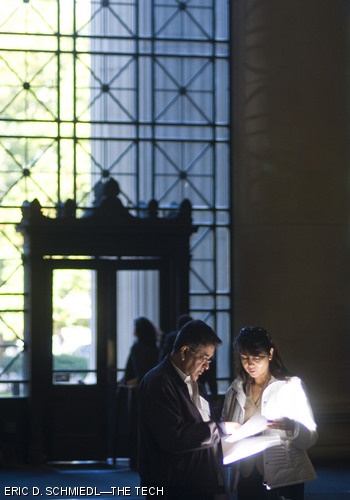 Parents Niranjan Kumar and Nita Kumar read in Lobby 7 on Oct. 17, the first day of Family Weekend at MIT. Family Weekend lasted 3 days and welcomed family members of current students with several fun events including the Nobel Laureate luncheon, an a cappella concert, and several informational panels.