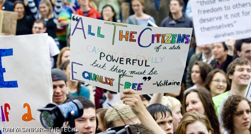 Protestors hold signs at the Join the Impact rally on Saturday outside Boston City Hall. The rally was a part of a national protest against the passage of Proposition 8, the ban on same-sex marriage in California.