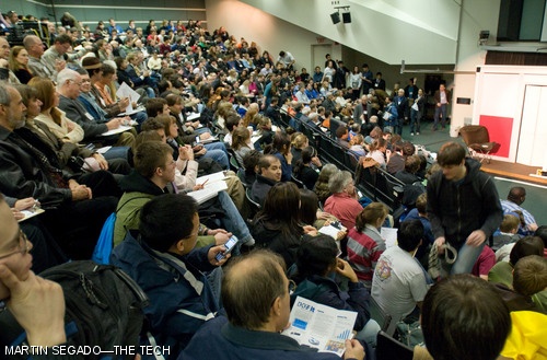 Audience members attending the Product Engineering Process (2.009) final presentations sat in the aisles of room 34-101 on Monday night, as most or all seats were taken. The room nominally seats 325 people.