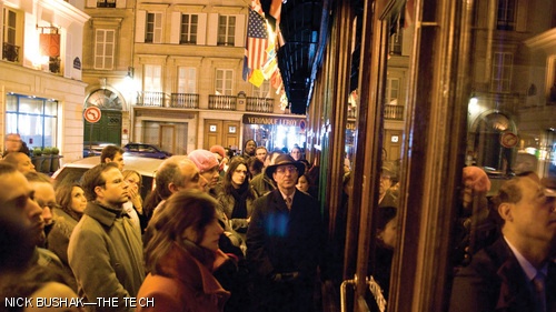 Parisians watch President Barack Obama’s inaugural address outside a packed Carr’s Irish Pub in downtown Paris yesterday.