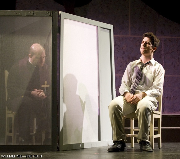 Peter (Yoni Gray ’10) seeks guidance from Father (Dave Berger) during “Confession” in the show “Bare” by the MIT Musical Theatre Guild.