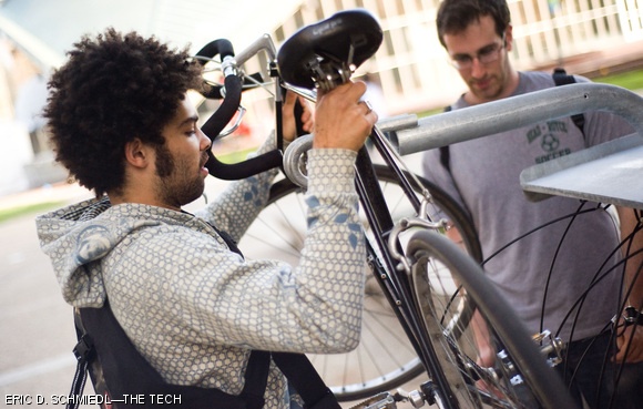 Robert A. Boyd ’10 lifts his bike off the repair stand outside the Zesiger Sports and Fitness Center after using the stand’s built-in bike pump to inflate his tires on Wednesday afternoon. MIT installed bicycle repair stands next to the Z-Center and next to the Stata Center recently.