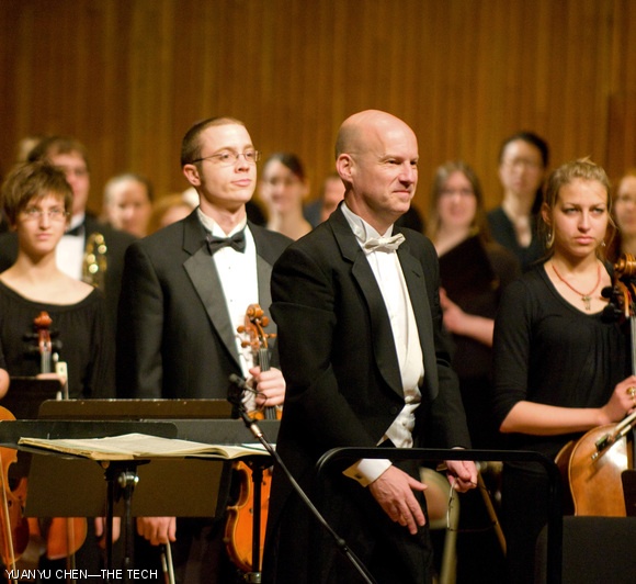 Dr. William Cutter, conductor of the MIT Concert Choir, takes a bow at the choir’s spring concert last Sunday in Kresge.