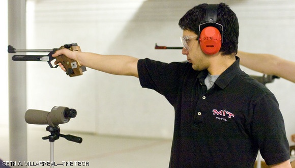 Gregory I. Telian ’11 focuses his attention downrange at the MIT vs. Navy Free Pistol competition this past Saturday in the basement of the duPont Athletic Center.