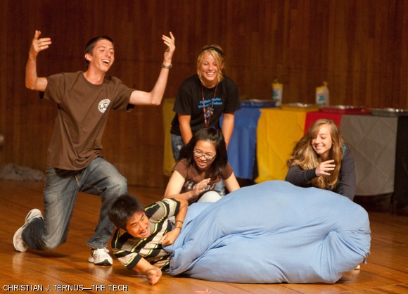 A group of freshmen compete against upperclassmen during the Kick-Off! orientation event on Sunday in Kresge. The game involved stuffing a bag with clothes and a person, then rolling the combination to the finish line.