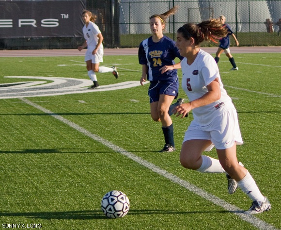 The Engineers shut out the University of Massachusetts Dartmouth with a 5-0 win on Tuesday at Steinbrenner Stadium. Here, midfielder Edith R. Reshef ’11 deftly maneuvers the ball down the sideline as she moves past her defender.