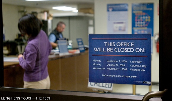 Customers make use of the MIT post office in the Student Center on Sept. 21. The post office is one of about 400 branches being considered for closure.