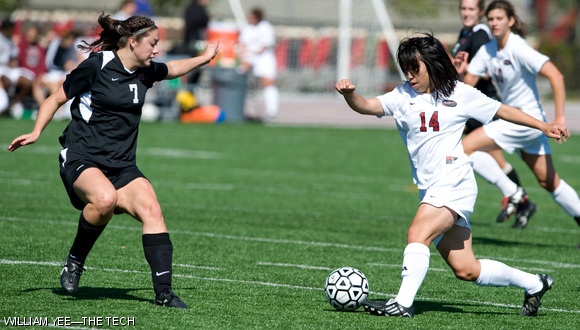 Emily Kuo ’13 dribbles through a Worcester Polytechnic Institute defensive player during the game on Saturday. The MIT Engineers won 4-0, extending their winning streak to five games.