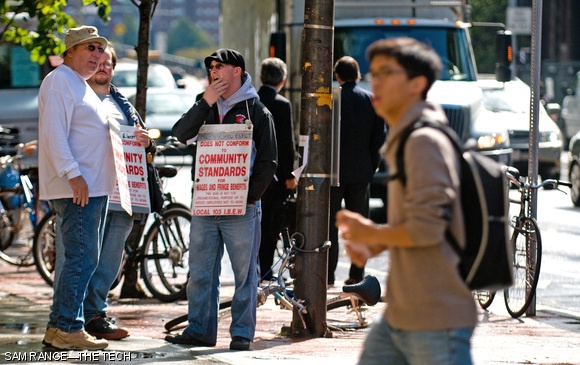 Picketers from the International Brotherhood of Electrical Workers stand outside Lobby 7 on Wednesday afternoon. Members of the electricians’ union have been protesting MIT’s contracting practices for over five weeks.