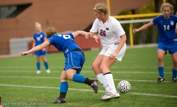 Stephanie D. Cooke ’13 guards a Wellesley team member during the women’s soccer game on Saturday. The Engineers won 2-1.
