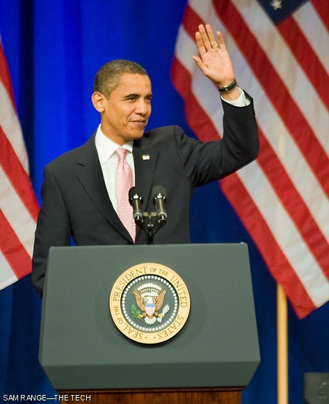 President Barack Obama waves to the cheering crowd in Kresge Auditorium after his introduction by Prof. Ernest J. Moniz, Director of the MIT Energy Initiative, on Friday. The President visited MIT to view laboratories and deliver a speech regarding his administration’s energy policy.