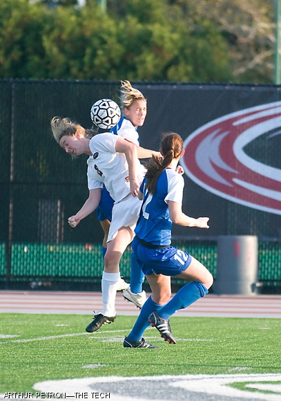 Forward Liz Theurer 10 successfully bounces a kick away from two Wheaton pursuers during a home game on Tuesday. The Engineers ultimately fell to the Lyons 2-0 during the shutout.