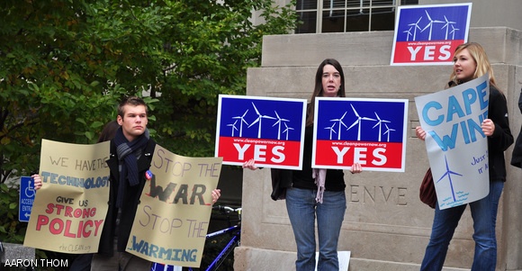 Demonstrators on the steps of 77 Mass. Ave. on Friday morning show their support for the Massachusetts Cape Wind project and other policies to combat global warming. Their gathering coincided with the President’s arrival at MIT for a speech concerning national energy research and policy.