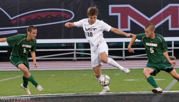 Forward Christian W. Therkelsen ’11 evades Babson sophomores Jimmy Stent and Ryan Obolewicz during the Engineers’ 2-4 loss on Saturday at Steinbrenner Stadium. Therkelsen was double-teamed throughout the game, but he still managed a goal and an assist.