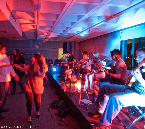 Audience members dance as MIT students (on stage from left) Burkay Gür ’11, Serdar Karatekin ’10, Tess E. Smidt ’12, Xavier R. González ’10, and Robert A. Drenkhahn ’12 of Flamenco fusion group Capricho perform in the Mezzanine Lounge on the third floor of the Stratton Student Center on Friday. The concert was part of a series of performances by MIT students’ music groups sponsored by the MIT Live Music Connection.