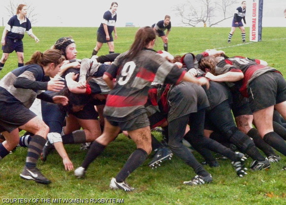 The MIT women’s rugby forwards drive a scrum while scrum-half Alyssa M. Baccarella ’11 prepares to collect the ball during the Engineers game against Middlebury last Saturday. MIT won the game, making them the New England Rugby Football Union Division III champions and securing them a place in the national collegiate rugby championships this upcoming weekend.