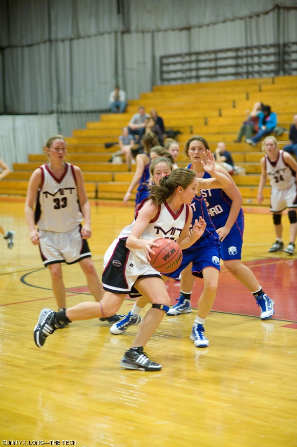 Erica N. Pino ’13 drives around a U.S. Coast Guard Academy defender in the first half of the women’s basketball game on December 2. The engineers were defeated 47-38.