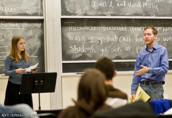 (left to right) Kathleen A. Clark-Adams ’10 and Adam J. Goldstein ’09, officers of the MIT Debate Team, speak at a public debate on Wednesday evening in 4-270. The debate focused on whether Independent Living Groups should be granted immunity if they call for help when students get sick at parties. Student rights and trust in the administration were the dominant issues in the round.
