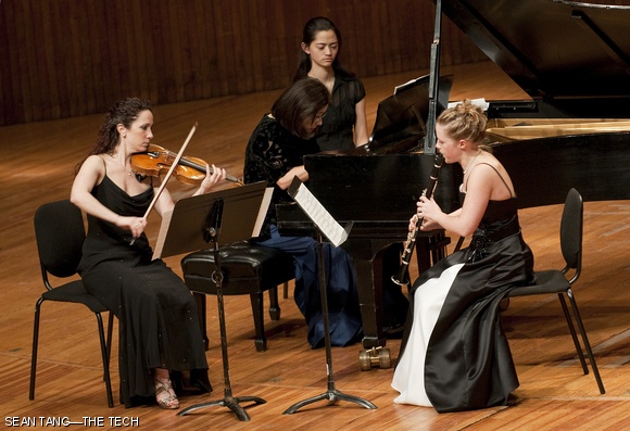 Violinist Sarita Uranovsky, clarinetist Molly Walker, and pianist Hiskao Hiratsuka play a musical piece dedicated to Noam Chomsky at a concert honoring the MIT Professor of Linguistics on Friday evening in Kresge Auditorium.