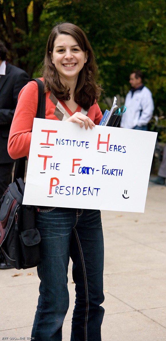 Reena L. Joubert ‘13 awaits the arrival of President Obama in front of 77 Mass. Ave. on Oct. 23. Hundreds lined Mass. Ave. hoping to catch a glimpse of the President, only for his motorcade to pass along Memorial Dr. The Presidential visit focused on advancing his national energy agenda.