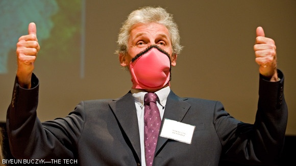 While wearing a brassiere over his mouth, Professor of Physics Wolfgang Ketterle, recipient of the Nobel Prize in Physics in 2001, gives two thumbs up to the winner of this year’s Ig Nobel Public Health Prize on Oct. 1. The winner, Dr. Elena N. Bodnar, created a bra that can be taken off and used as a “gas mask” in the event of an emergency. The Ig Nobel Prizes, held annually at Harvard University, are awarded to scientists for “achievements that first make people laugh, then think.”