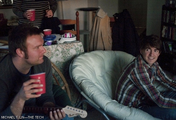 Cameron Hood (left) and Ryan Green relax between songs as the evening winds down in Caitlin Mason’s apartment on March 7. Mason invited them over for gaming after missing their March 6 concert.