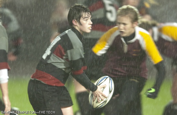 Back Ekaterina R. Kononov ’12 prepares to pass during the women’s rugby team’s scrimmage in the cold, windy rain on Saturday evening on Robert’s Field. The club team beat Boston College 12-3.