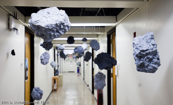To celebrate the 400th anniversary of the Sidereus Nuncius, Galileo’s first observations through a telescope, hackers hung an asteroid belt from the ceiling on the 8th floor of the Green Building on Tuesday. They also installed planets and a display plaque commemorating the occasion.