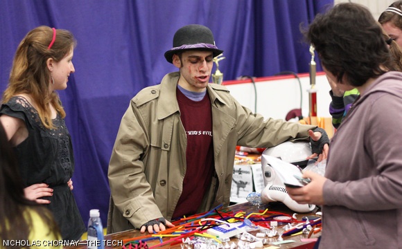 With a variety of props before them, members of the Musical Theatre Guild speak to prefrosh during the CPW Festival.