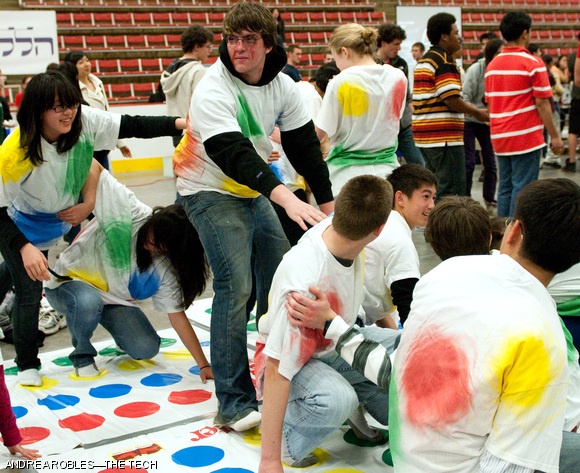Prospective freshmen play a twisted version of Twister during the CPW Festival held in Johnson on Thursday. Participants in the East Campus-sponsored event wore T-shirts with twister dots on them, adding a human dimension to the Twister mat.